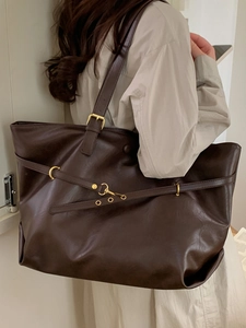 Large dark brown vintage tote bag in glossy leather with gold hardware for women