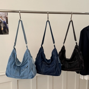 Detailed comparison of three denim tote bag colors: light blue, dark blue and black