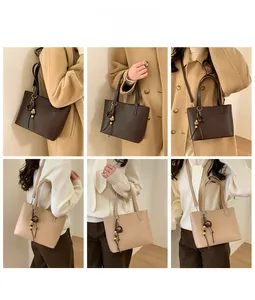 Detail shots of minimalist bucket bags in dark brown and beige with beaded tassels