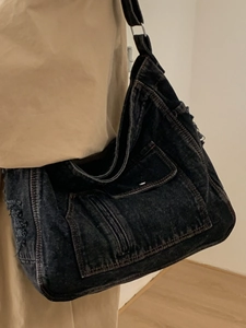 Large vintage washed denim hobo shoulder bag with frayed edges and adjustable wide strap