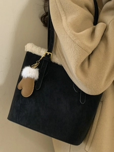 Vintage black suede hobo bag with white plush trim and brown glove charm for winter
