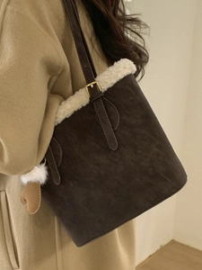 Vintage coffee brown bucket bag with plush white faux fur trim and heart charm detail