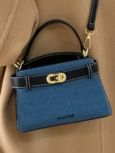 Blue denim texture handbag with black leather straps and golden rotating lock for women