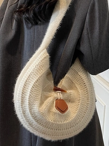 Chic beige knit shoulder bag with brown leather clasp and horn button for women