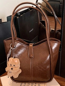 Minimalist coffee brown oil wax leather tote bag with cute plush puppy keychain