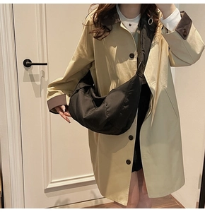Practical casual black crescent crossbody bag shown on model to demonstrate large capacity