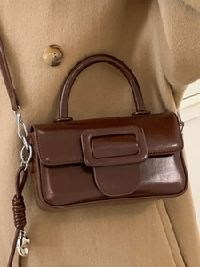 Retro dark brown crossbody handbag with glossy leather finish and large square buckle