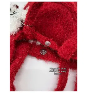 Detail of red plush knit bag with magnetic closure and red checkered lining interior