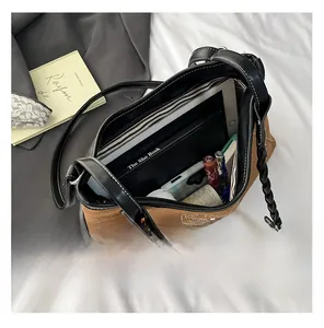 Spacious tote bag interior detail showing storage for books, tablet, and cosmetics