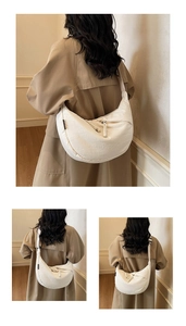 Minimalist white crescent canvas bag featuring woven rope detail and wide shoulder strap