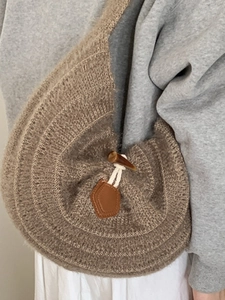 Brown knit hobo shoulder bag with toggle closure for casual winter styling