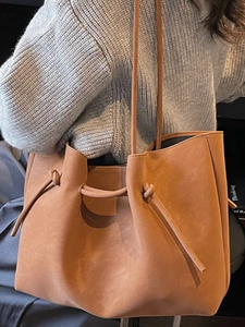Brown minimalist tote bag in suede texture with drawstring knot detail for women
