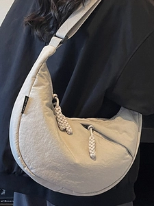 Minimalist beige dumpling canvas bag with pleated texture for women crossbody style