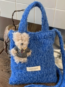 Winter plush woven shoulder bag in Klein blue with cute bear pendant for daily commute