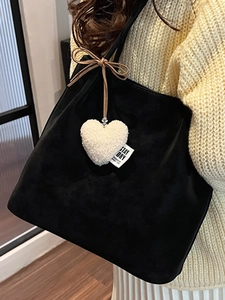Retro black faux suede tote bag with heart charm and bow detail for 2025 winter style