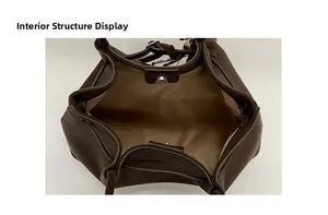 Detailed interior of deep brown leather tote showing light lining and magnetic closure