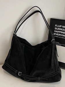 Large black matte hobo tote bag with contrast white stitching and metal buckle details