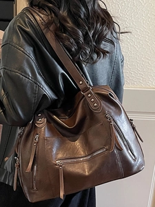 Large vintage coffee tote bag with decorative rivets and zippers for urban casual wear