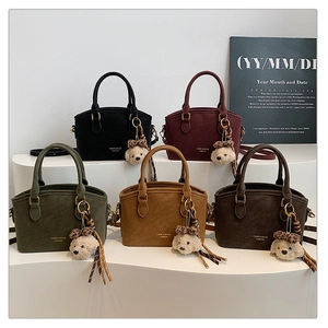 Collection of retro matte handbags in five colors with cute bear charms and woven straps