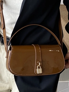 Deep brown patent leather shoulder bag with gold padlock and glossy finish
