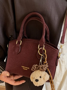 Retro burgundy frosted handbag for women with plush puppy charm and golden text