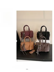 Collection of four matte leather Boston bags in burgundy black camel and dark grey colors