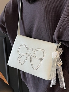 White faux leather crossbody bag with rivet bow and lace pearl charms for women