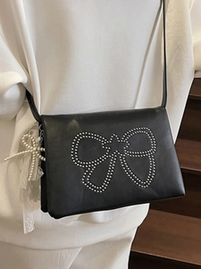 Fashionable black leather crossbody square bag with silver rivet bow and pearl lace charms