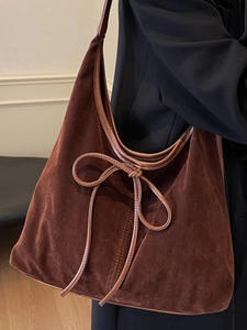 Retro brown suede hobo bag for women featuring a minimalist bow design on a shoulder tote
