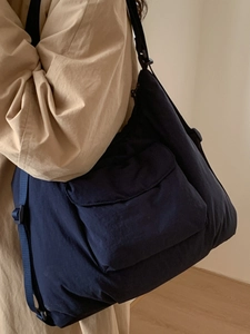 Large capacity navy blue canvas tote bag with adjustable strap and front pocket