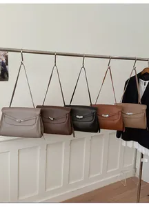 Detail view of five colors of vintage leather tote bags with high-quality metal turn-locks