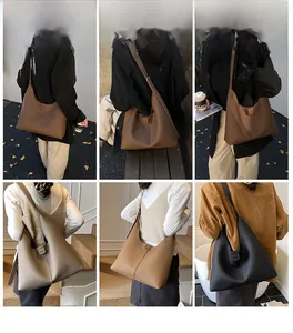 Detailansicht verschiedener Farben der minimalistischen Hobo-Taschen an einem Model