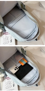 Vue détaillée de l'intérieur du sac à dos vert menthe avec compartiment PC et étoiles
