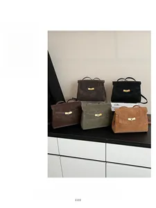 Classic trapezoid tote bags in multiple colors featuring vintage gold twist lock hardware