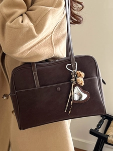 Retro dark brown leather tote bag with heart charm and white stitching details
