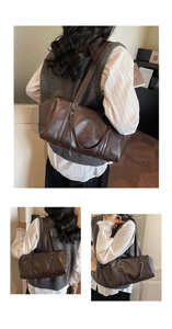 Detail shot of vintage dark brown faux leather Boston bag with double metal zippers