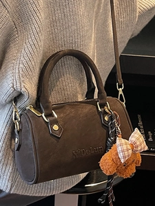 Vintage dark brown Boston handbag in matte leather with teddy bear charm for winter