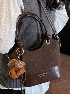 Retro brown bucket bag with plush bear pendant and knot handle for women commuting