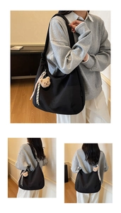 Détail du sac hobo en nylon noir avec broderie Malkian et charm ours en peluche