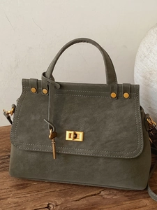 Olive green suede vintage messenger bag with gold twist lock and adjustable shoulder strap