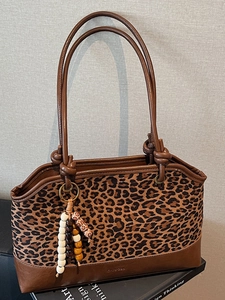 Retro leopard print tote bag with brown leather trim and beaded charm for daily commute