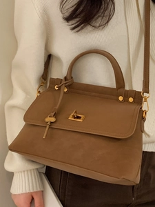 Vintage brown leather shoulder bag with gold metal clasp and key charm for women
