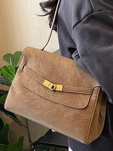 Vintage brown leather crossbody tote bag for women with gold twist lock and shoulder strap