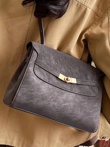 Vintage dark gray leather tote bag with gold twist-lock and shoulder strap for women