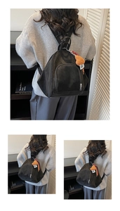 Detail eines schwarzen Nylon-Rucksacks mit Herzanhänger und mattem Finish für Damen