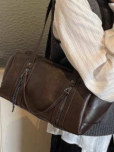 Brown leather Boston shoulder bag with silver zippers and chain for winter 2025