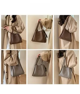 Detail shots of minimalist bucket bag in coffee and taupe tones with leather texture