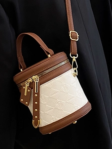 Retro monogram bucket bag in cream and brown leather with gold hardware for women
