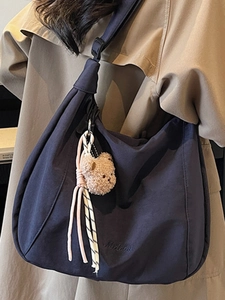 Large dark blue canvas tote bag with teddy bear pendant and adjustable strap for women