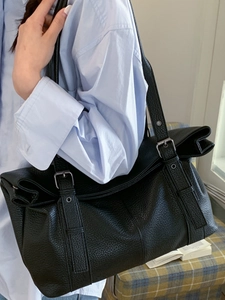 Retro black leather tote bag for women featuring large capacity and a buckle strap design